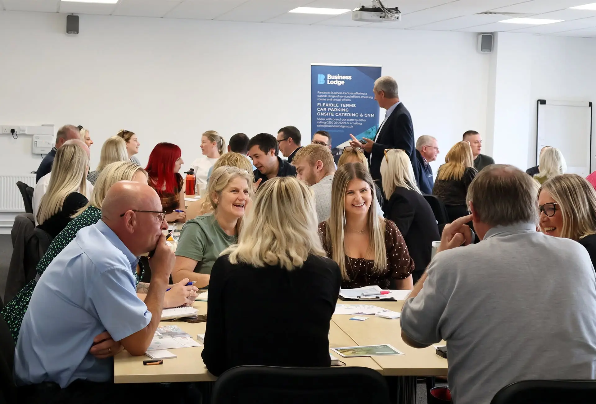 Hero photo — members networking at Commerce House